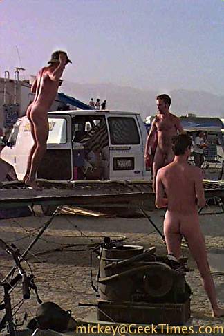 aq qm add naked guys at burning man photo