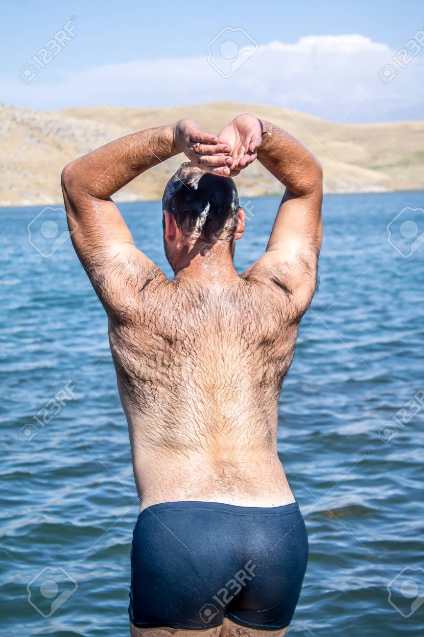 dana poulson add hairy guys on the beach photo