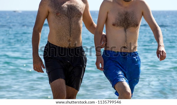 butt bucket add hairy guys on the beach image